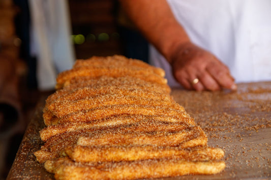 Foto apetitosa de churros para vender em destaque, ilustrando a receita apresentada no blog Granuz